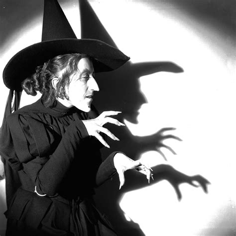 Wicked witch brandishing a blade in the stone